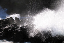 Splash Of Waves Hitting The Rocks On The Beach