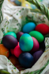 Wall Mural - Colored Easter eggs in a basket