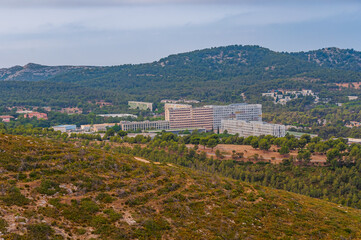 Sticker - Scenic shot of the Universite de Marseille surrounded by mountain forests and a field in France