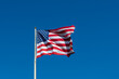 american flag on sky waving in the wind