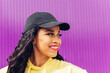 © Dani D.G - Delighted black woman near purple wall
