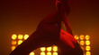 © stockbusters - Seductive pole dancer performing erotic dance in club. Girl spinning on pylon.