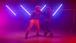 © stockbusters - Couple performers making hiphop show in club. Two modern dancing street style.