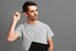 © SHOTPRIME STUDIO - handsome man in gray t-shirt paper folder posing fun isolated background