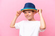 © luismolinero - Little caucasian boy wearing a hat isolated on pink background