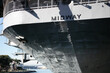 The USS Midway on the San Diego Embarcadero with the Welcome Home Kissing Sailor Staute in View below the Stern