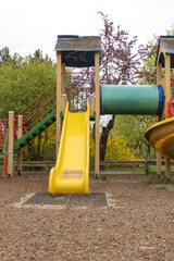 Wall Mural - Vertical shot of Playground for children in the park