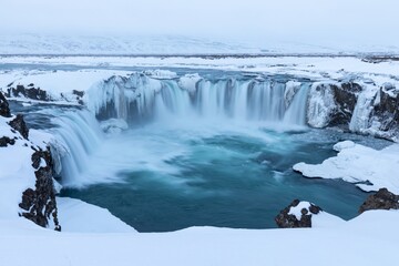 Wall Mural - godafoss waterfall at sunset in winter, iceland.