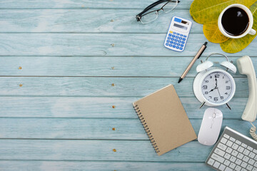 Poster - Top view above of office desk table with laptop, notebook and coffee cup with equipment other office supplies. Business and finance concept. Workplace, Flat lay with blank copy space.