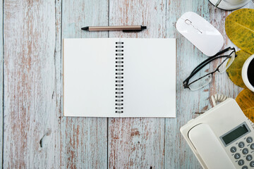 Poster - keyboard computer, smartphone with a blank screen, a notebook, and a cup of coffee are shown on a modern white office desk table. Flat lay, top view with copy .