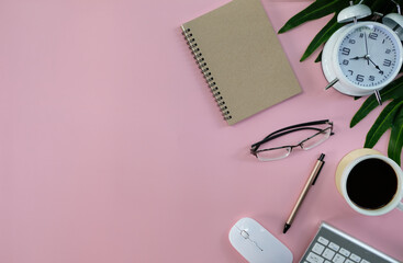 Poster - Blank notebook with pen are on top of computer keyboard over white office desk table with office supplies. Top view with copy space, flat lay