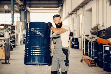 Wall Mural - A factory worker relocation barrel with petroleum.