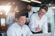 © Yaroslav Astakhov - Focused mature female employee discussing project, showing presentation to skilled team leader.
