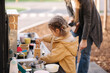 © Aleksandr - Adorable little girl playing in toy kitchen outdoors. Cute three year old girl have fun in kids city