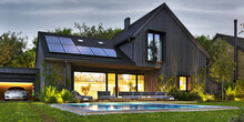 Night View Of Beautiful Modern House With Solar Panels And Electric Car