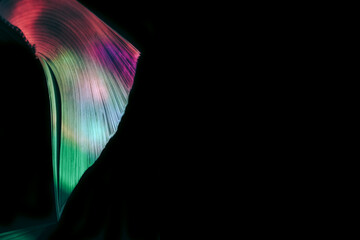 Fototapete - Close up Beautiful book pages in the multi color light on a night. Background pattern for design. Macro photography view.