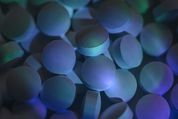 Fototapete - Pills or drugs in a package under neon light. Beautiful background pattern for design.