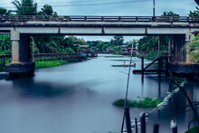 A Boat In The Canal ,Pathumtanee ,Thailand  (smooth Water Surface , Walkway Along The Canal