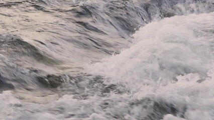 Poster - Slow motion of water stream in a mountain river close-up