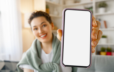 Woman showing smartphone.