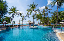 Amazing Tropical Paradise Beach With Swimming Pools And Coconut Palms
