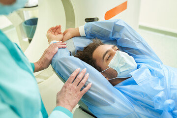 Wall Mural - Afro American man doing spectroscopy in clinic