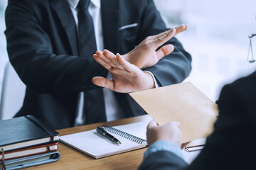 lawyer refuses to accept bribe from business people in contracting. corruption and anti bribery conc