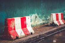 Red White Concret Barrier Stop Going Sign On Street Stand On Footpath Green Painted Old Wall Background