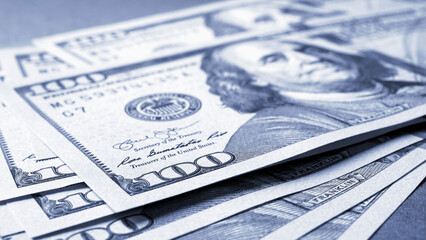 Wall Mural - american paper money. several one hundred dollar banknotes lie on textured surface. focus on the num