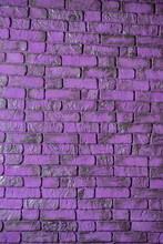 Violet Textured Brick Wall As Background