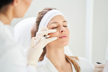 A scene of medical cosmetology treatments botox injection.