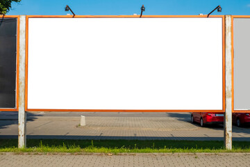 Advertising billboard mock-up in the city on a sunny summer day