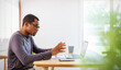 © paulaphoto - Portrait of African American business man talk on meeting conference with notebook laptop home office. Modern man at desk computer work from distance. Startup business online sme telemarketing concept