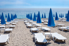 Beach Chairs And Umbrellas