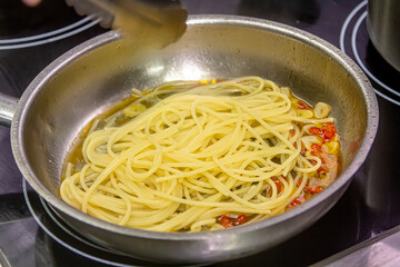 Wall Mural - Vegetarian Italian Pasta Spaghetti Aglio E Olio with garlic bread, red chili flake, parsley, parmesan cheese.