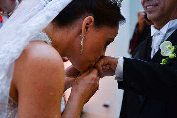 Wall Mural - bride kissing groom's hand
