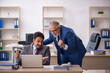 © Elnur - Two male colleagues working in the office