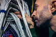 © Johnér - IT technician working in server room