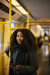 © Johnér - Woman in bus holding cell phone