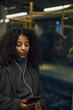 © Johnér - Woman in train using cell phone