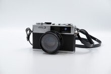 Isolated White Background Beautiful Vintage Analog Rangefinder Film Camera. 70's Decade Film Camera. Front View Image.