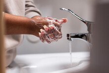 Mid Section Of Woman Washing Hands