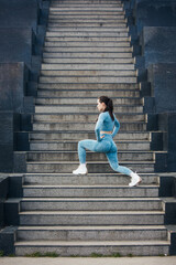 Wall Mural - Portrait of beautiful fit woman exercising in the park. Caucasian female fitness model working out in the morning.