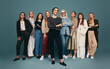 © Jacob Lund - Happy young woman standing with a group of diverse women