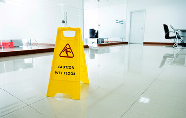 Wall Mural - Wet floor caution sign in office