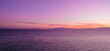 Lila Sonnenuntergang am Meer
