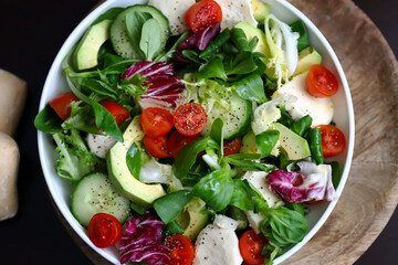 Wall Mural - Healthy salad with vegetables and avocado. Diet food.