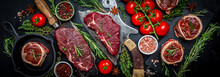 Variety Of Raw Black Angus Prime Meat Steaks Beef Rump Steak, Tenderloin Fillet Mignon For Grilling On Old Meat Cleaver On Dark Background. Long Banner Format. Top View