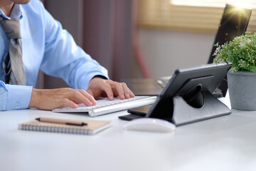 Poster - Businessman working on laptop, Working table in model office, Laptop computer on desk.