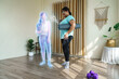 Fat woman standing communication with yoga coach in virtual people in the metaverse platforms at home. Technology of digital world in parallel with the physical one in the future concept.